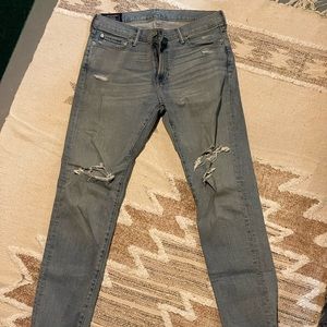 Men’s lightly worn Abercrombie distressed faded denim.